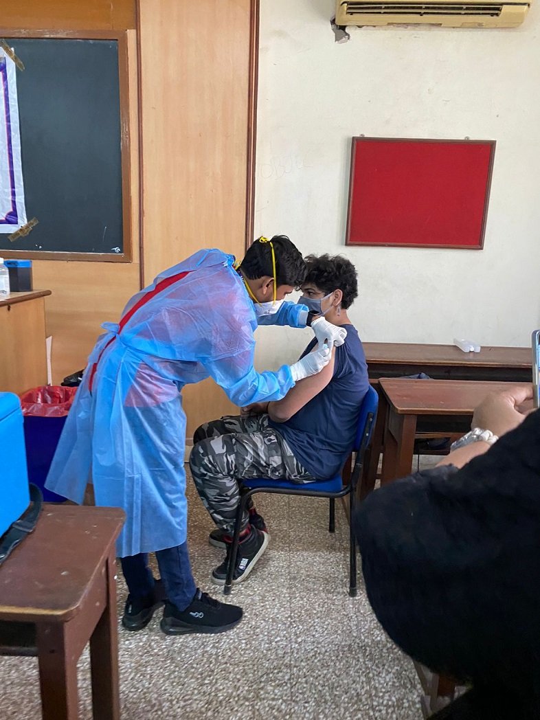 A student getting vaccinated