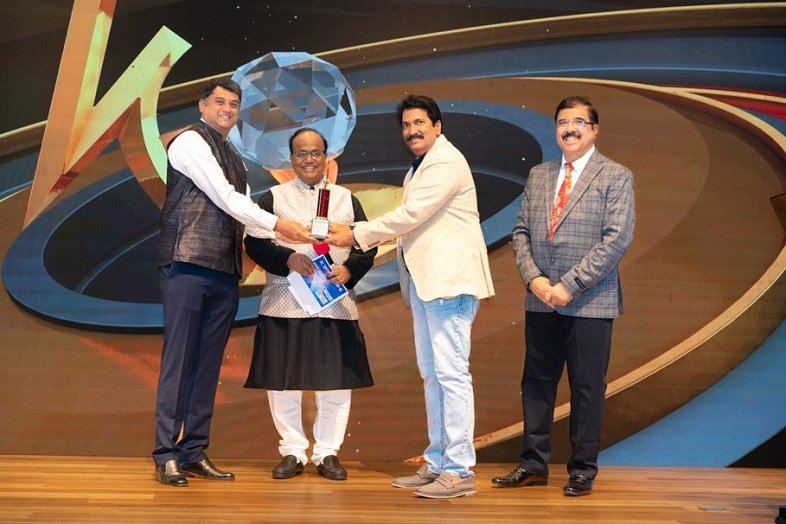 Anil Sunkar, Producer _AK Entertainments seen receiving Telugu Times Business Excellence Awards through the hands of JA Chowdary