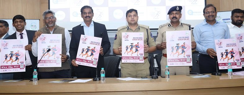 Avinash Mohantay, D. Joel Davis seen unveiling the poster of the Grace Cancer Run 2024. Also seen are Dr Chinnababu Sunkavalli, Ramesh Kaza, Prashant Nandella and others-7